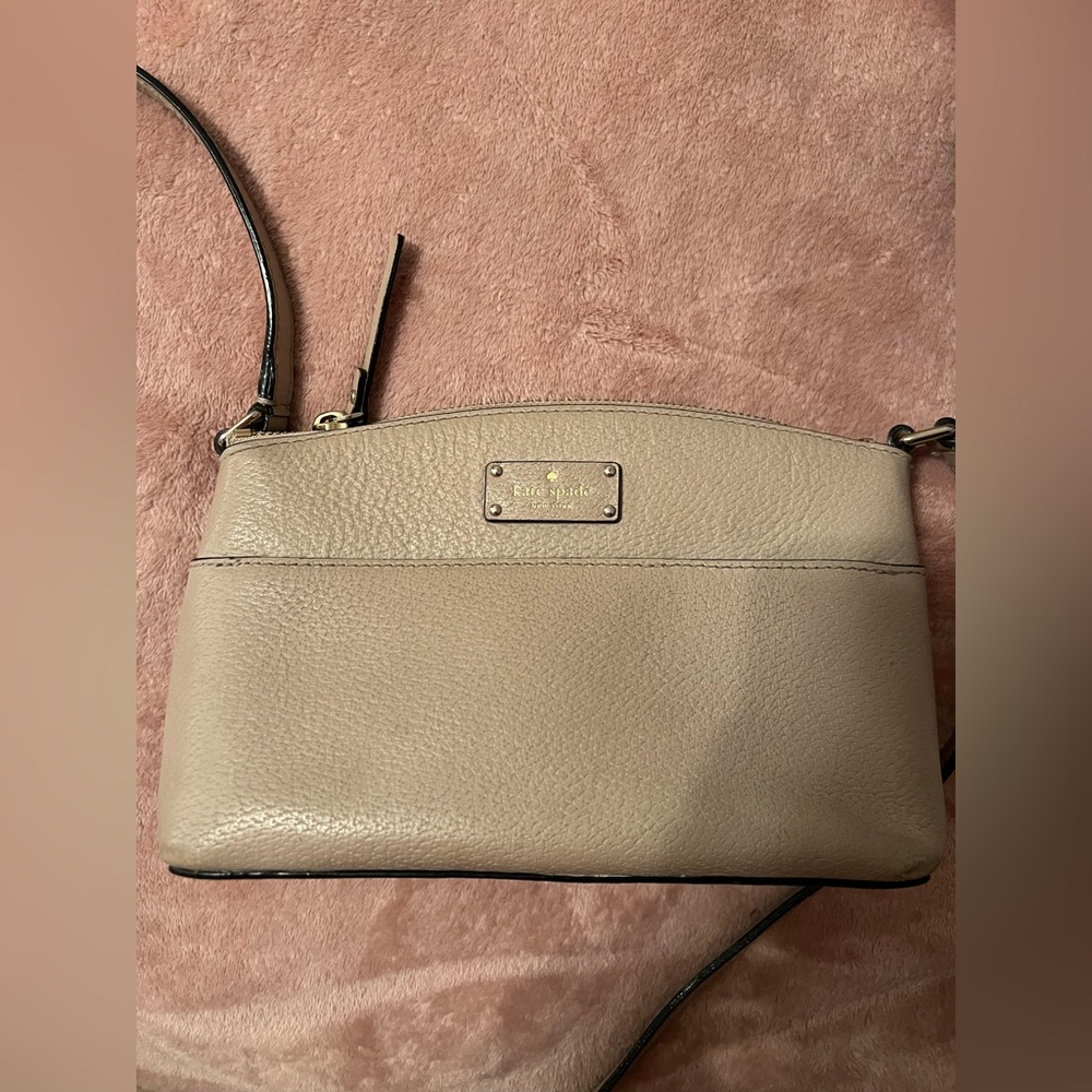Nude Kate Spade Purse. Does have a little stain but isn’t too noticeable.